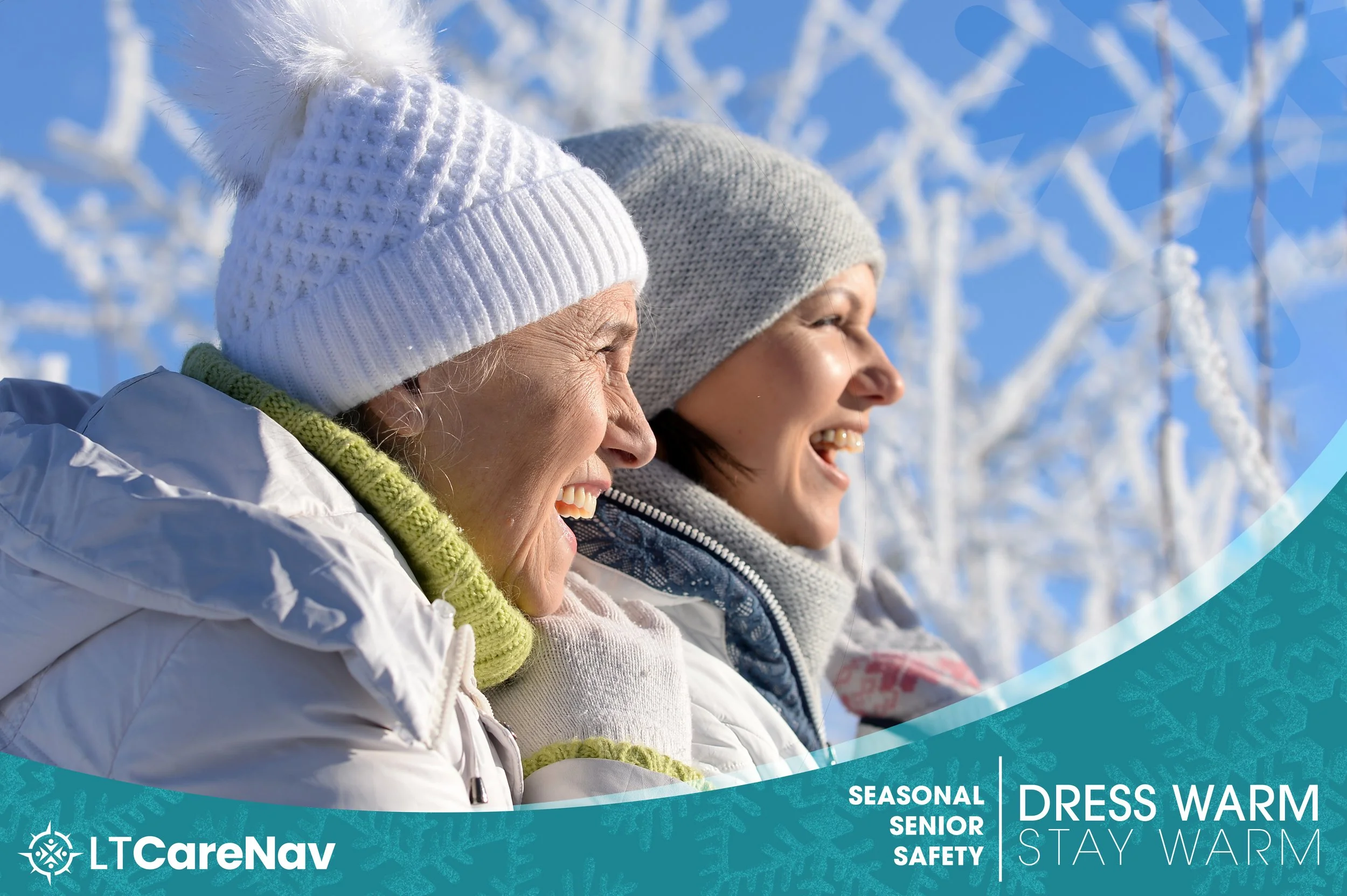 Two women in winter clothing smiling and enjoying outdoors in a snowy landscape with snow-covered trees.