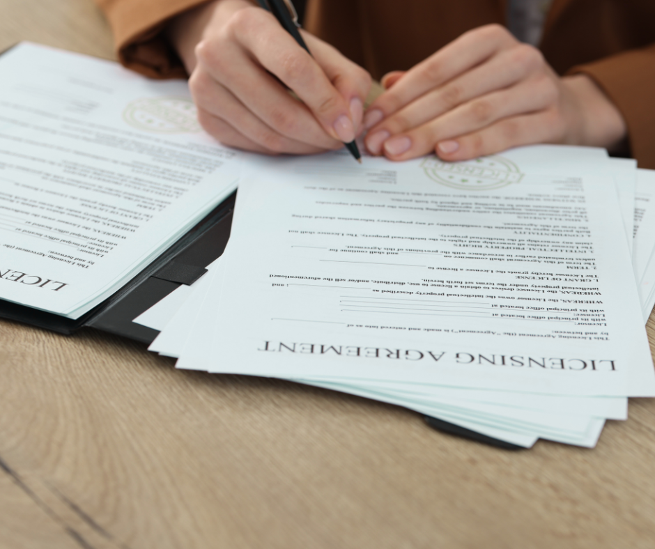 a small business owner signing onto a licensing agreement