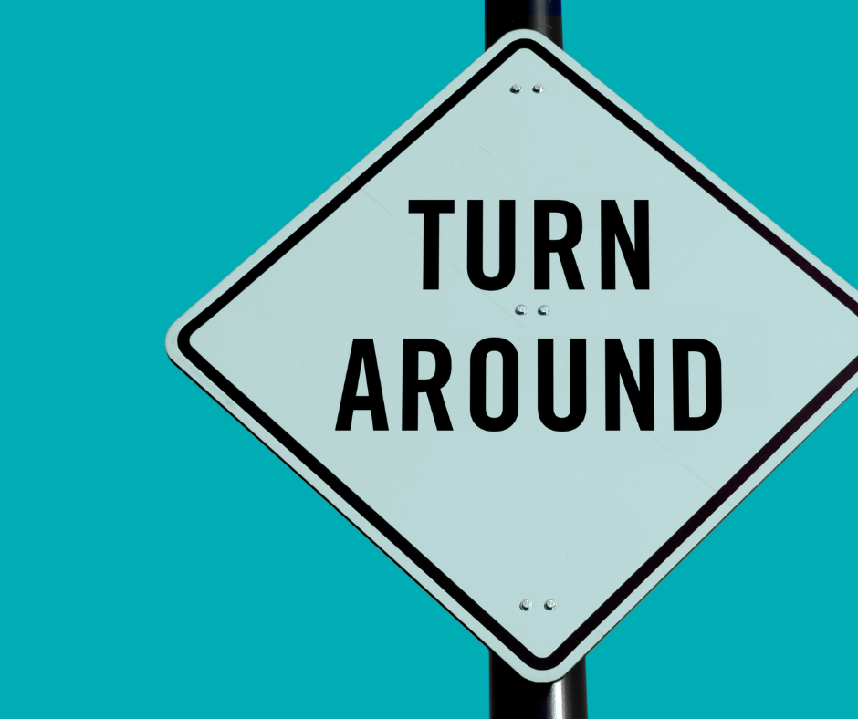 a caution road sign with "turn around" suggesting turnaround times