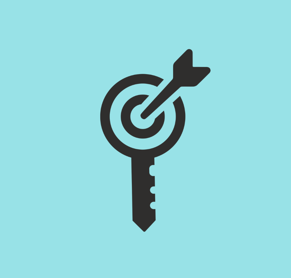 A black key with a dartboard and dart on top of it, symbolizing goal achievement.