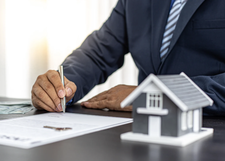 Realtor signing paperwork