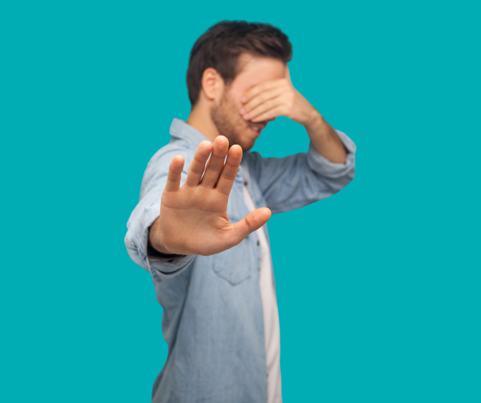 a business owner with his eyes shut, suggesting that they're ignoring local seo signals