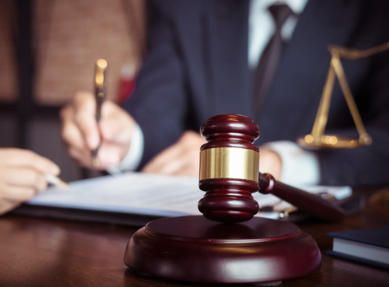 Lawyer with a gavel in the foreground