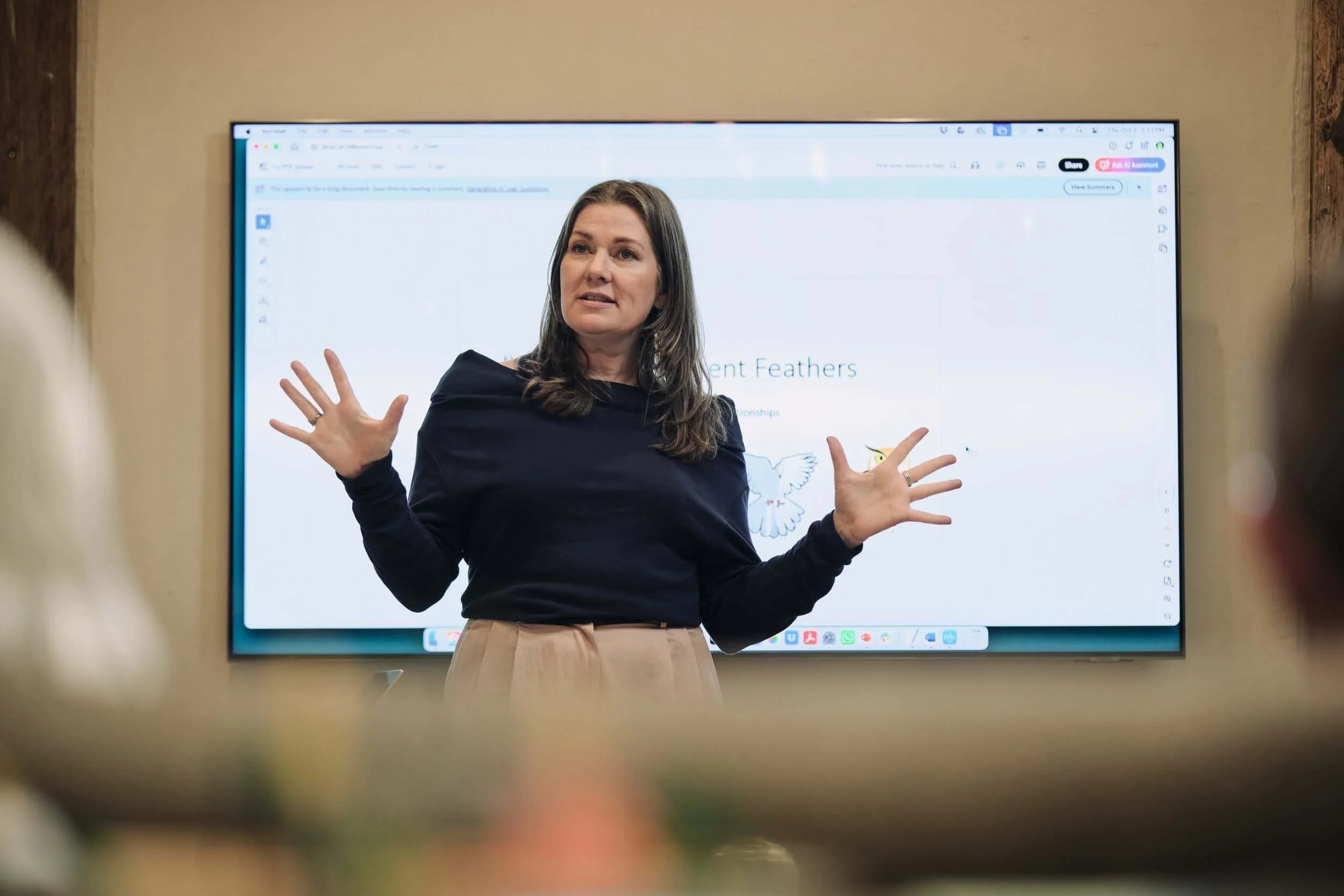 Christal speaking at a retreat