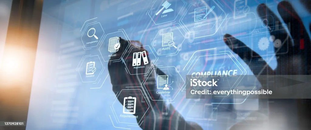 Person interacting with a touchscreen displaying compliance-related icons such as audit, law, and policy.