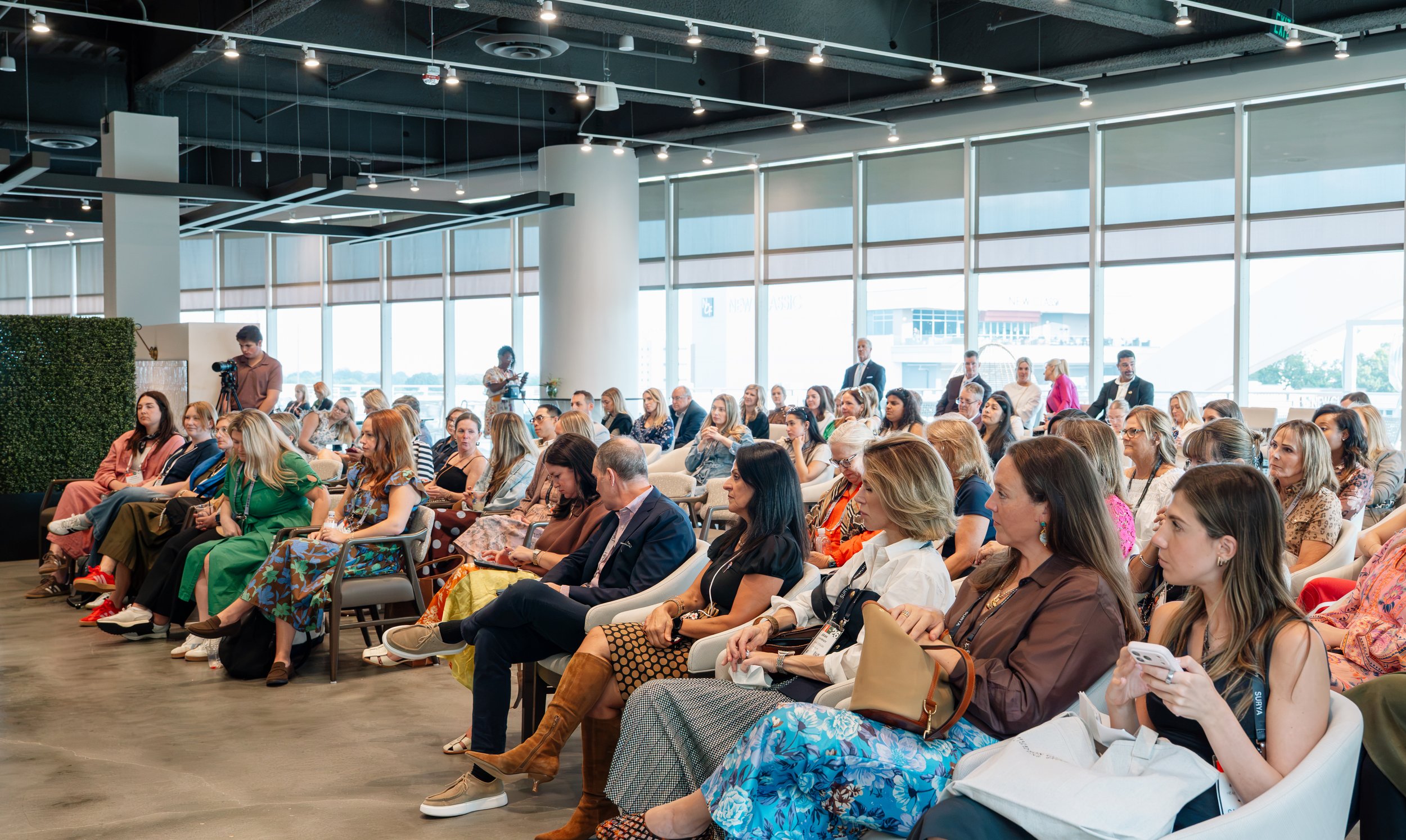 Audience members watching panel at High Point Market in North Carolina