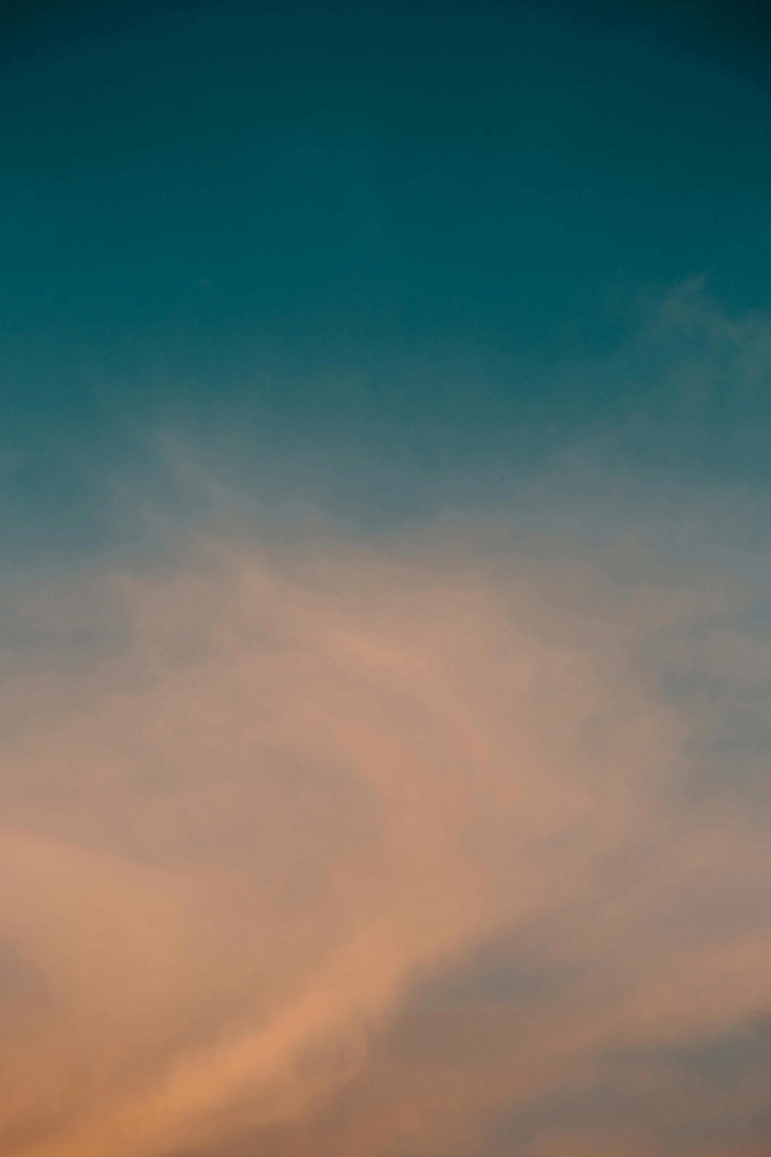 Colorful sky during sunset with soft pink and blue hues.