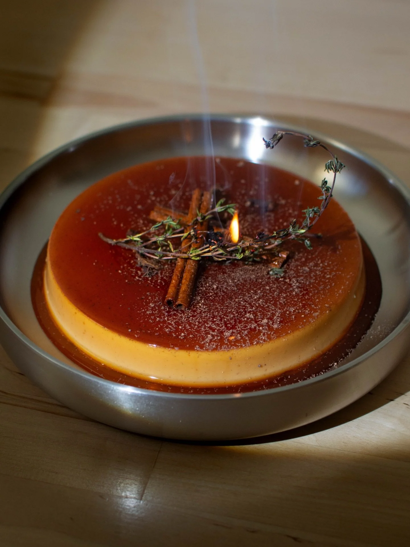 Yule Cr&egrave;me
(The first of our Limited Release edition)
A winter eggnog custard steeped in cinnamon, clove, and fresh nutmeg, finished with a brandy caramel that glows like firelight. A quiet holiday moment in flan form and an eggnog you&rsquo;d