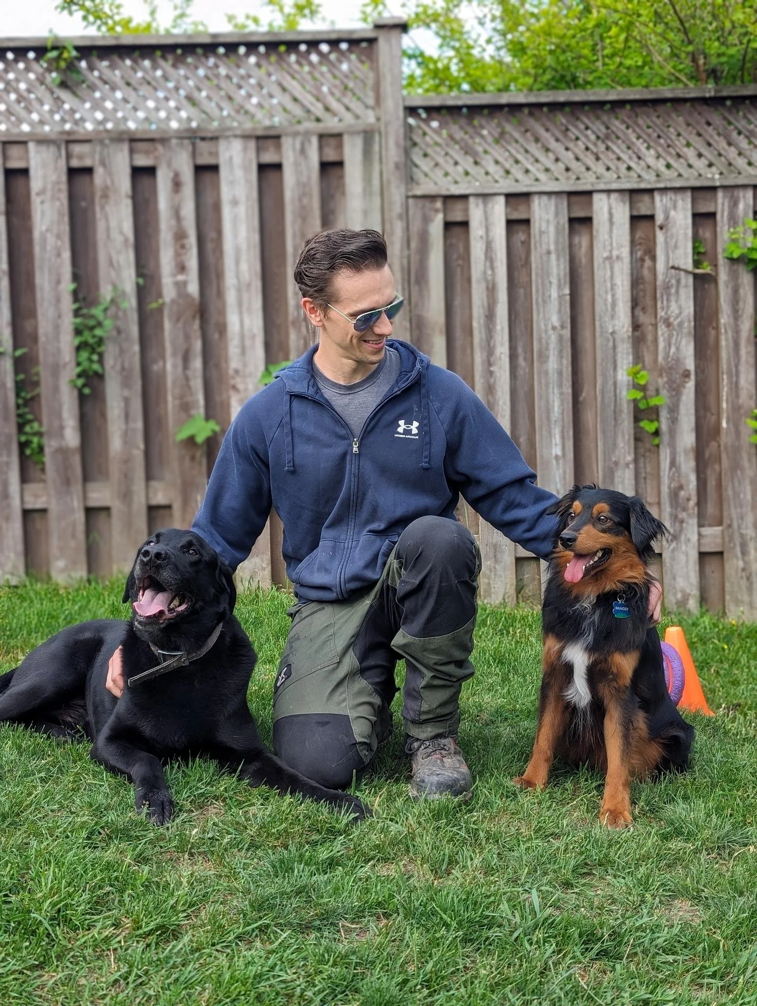 Dog trainer with happy dogs