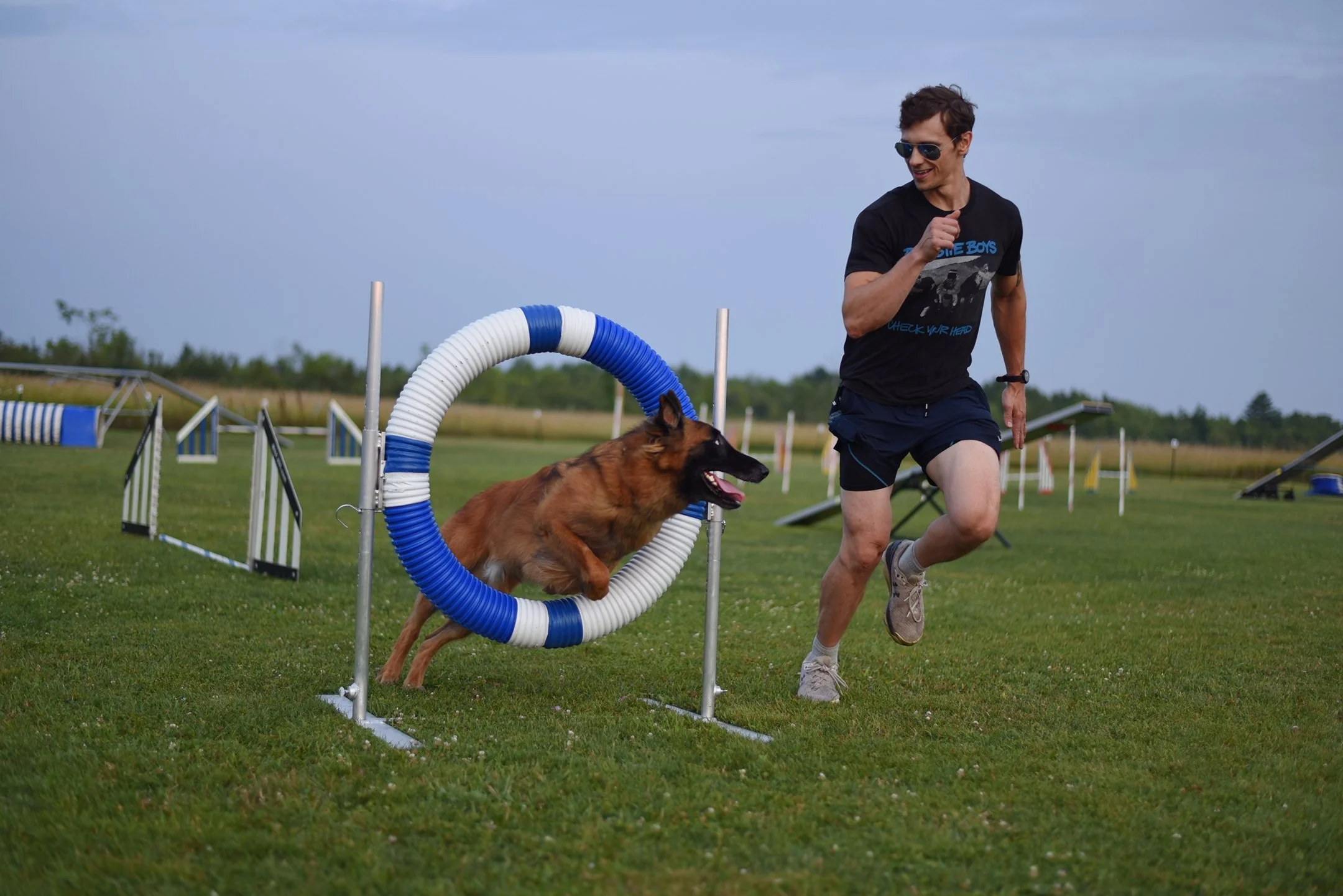 Dog trainer and malinois agility team