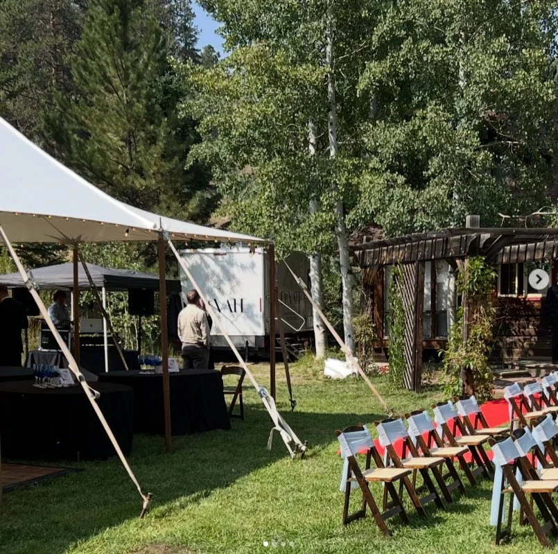 Luxury wedding restroom trailer discreetly placed at Colorado outdoor tent wedding