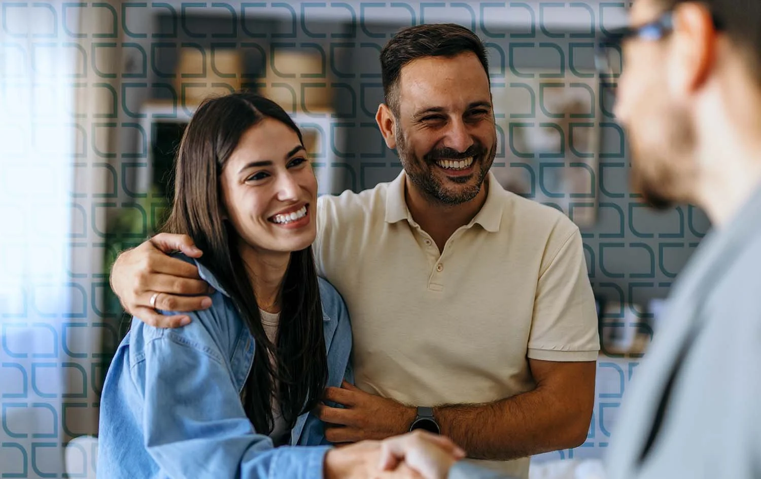 A happy couple greeting their mortgage broker to help them acquire their dream home amongst many lenders.