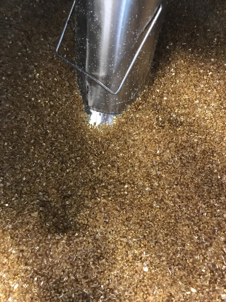 Amber-colored engineering thermoplastic pellets used as feedstock for high-temperature filament extrusion