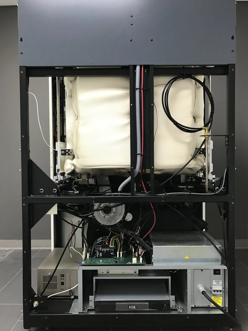 Rear of Fortus 400mc showing dedicated blower fan, backup power supply and insulated chamber design