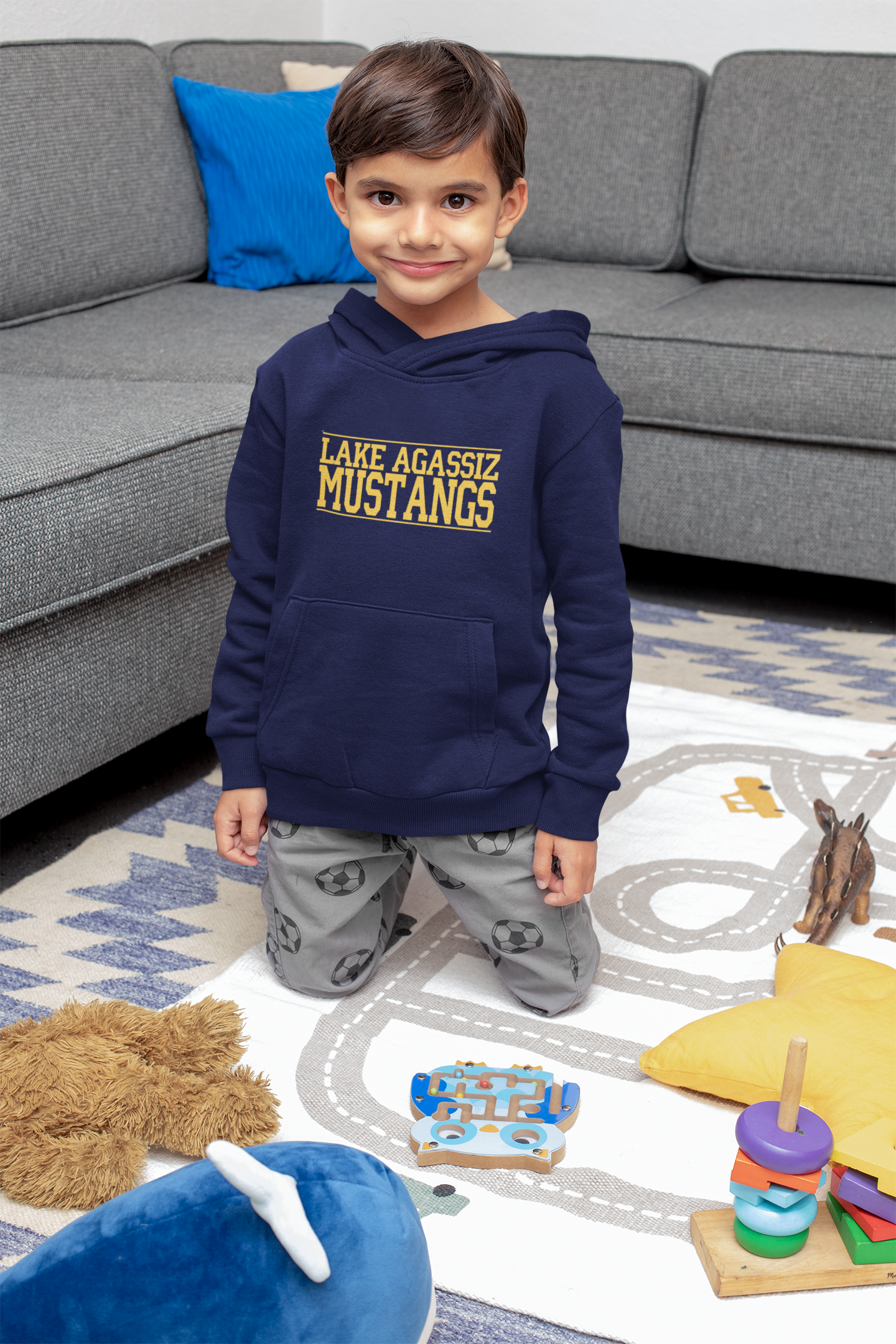 pullover-hoodie-mockup-featuring-a-happy-boy-playing-on-the-floor-32168.png