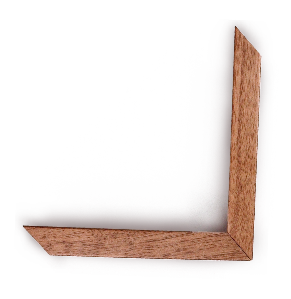 Close-up of a corner of a rectangular wooden picture frame with a glass front, showing the frame's mitered corners and a plain white wall background.
