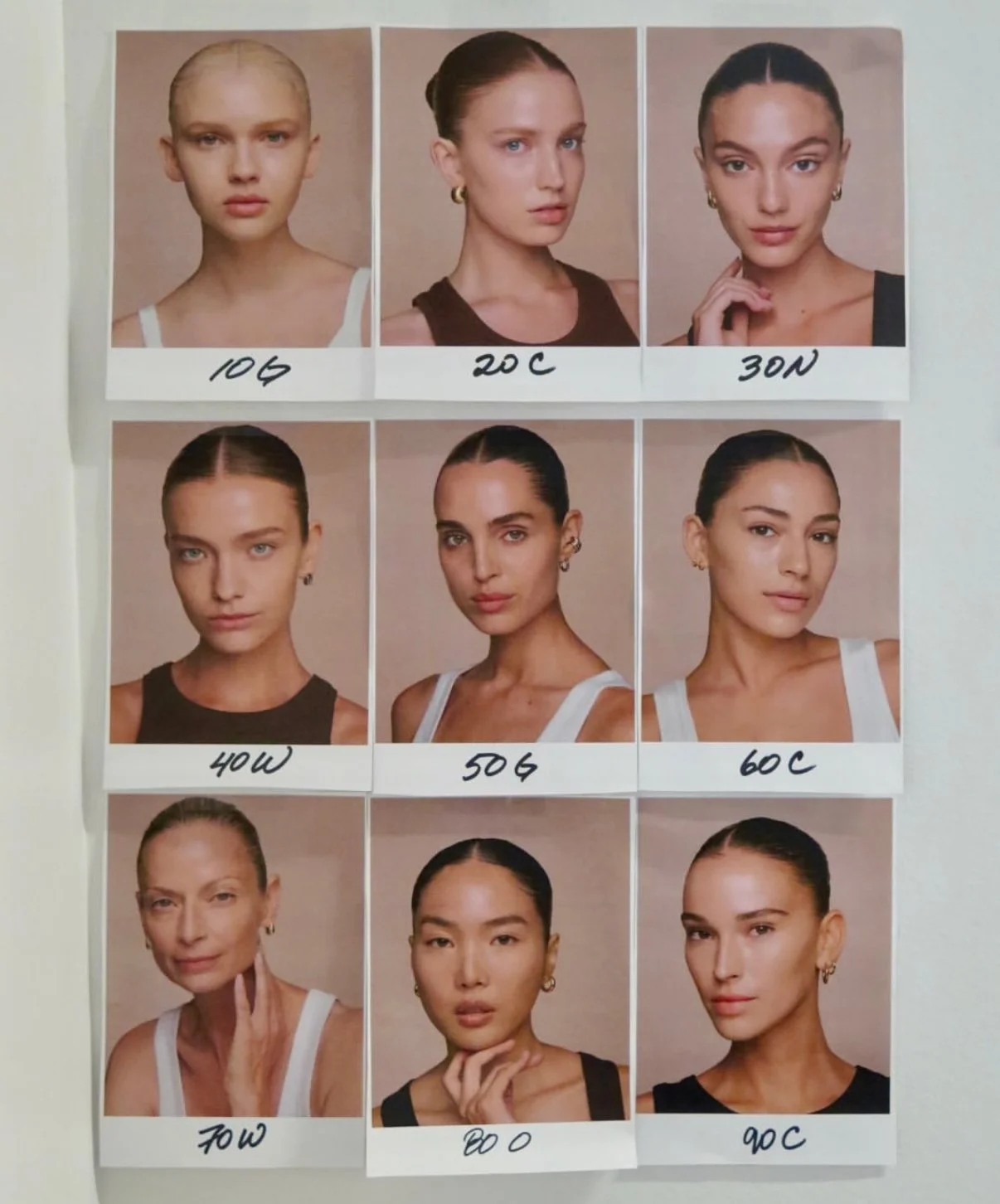 A collection of nine portrait photographs of women arranged in a 3x3 grid, each labeled with different bra cup sizes: 104A, 20C, 30N, 40W, 50G, 60C, 70W, 80O, and 90C.