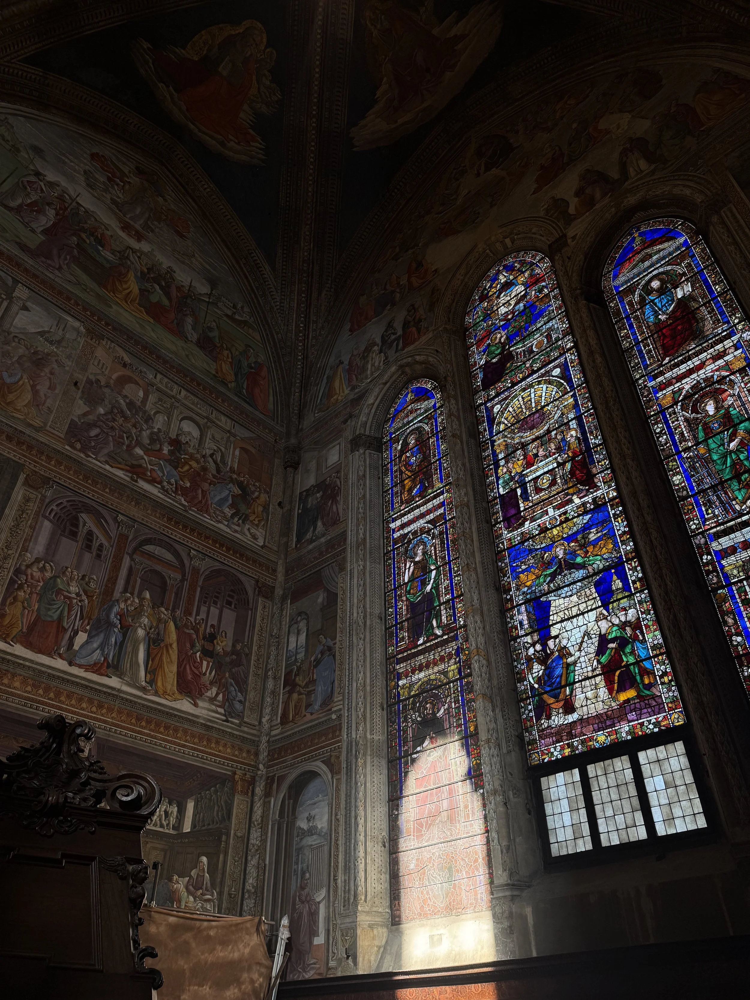 Santa Maria Novella, Florence. The Tornabuoni Chapel, frescoed by Ghirlandaio's workshop, 1485–1490. The stained glass follows his designs and dates to 1492.