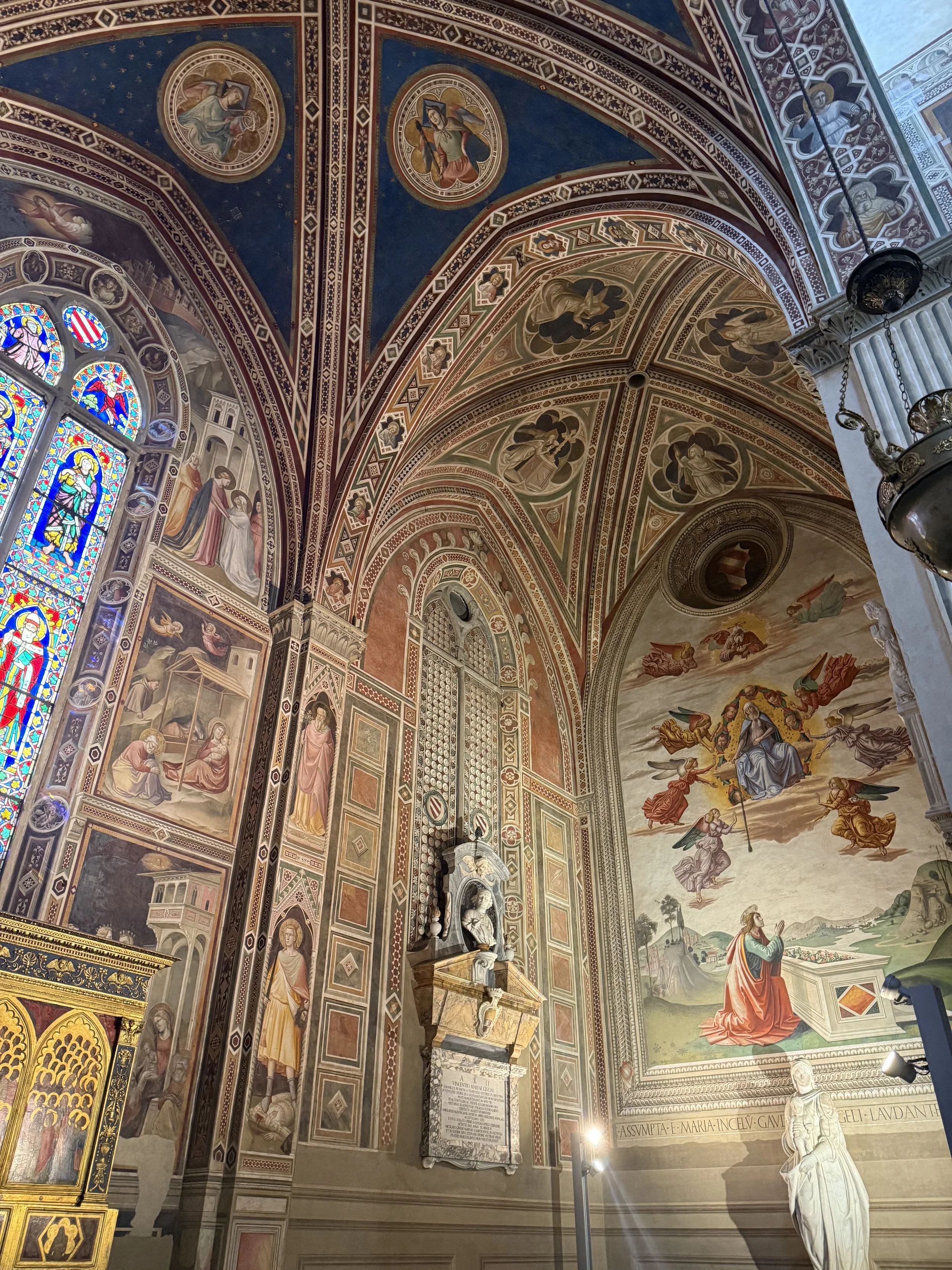 Santa Croce, Florence. The Baroncelli Chapel, begun 1328, with frescoes and stained glass by Taddeo Gaddi. The Assumption on the right wall is a 1490s addition by Bastiano Mainardi.
