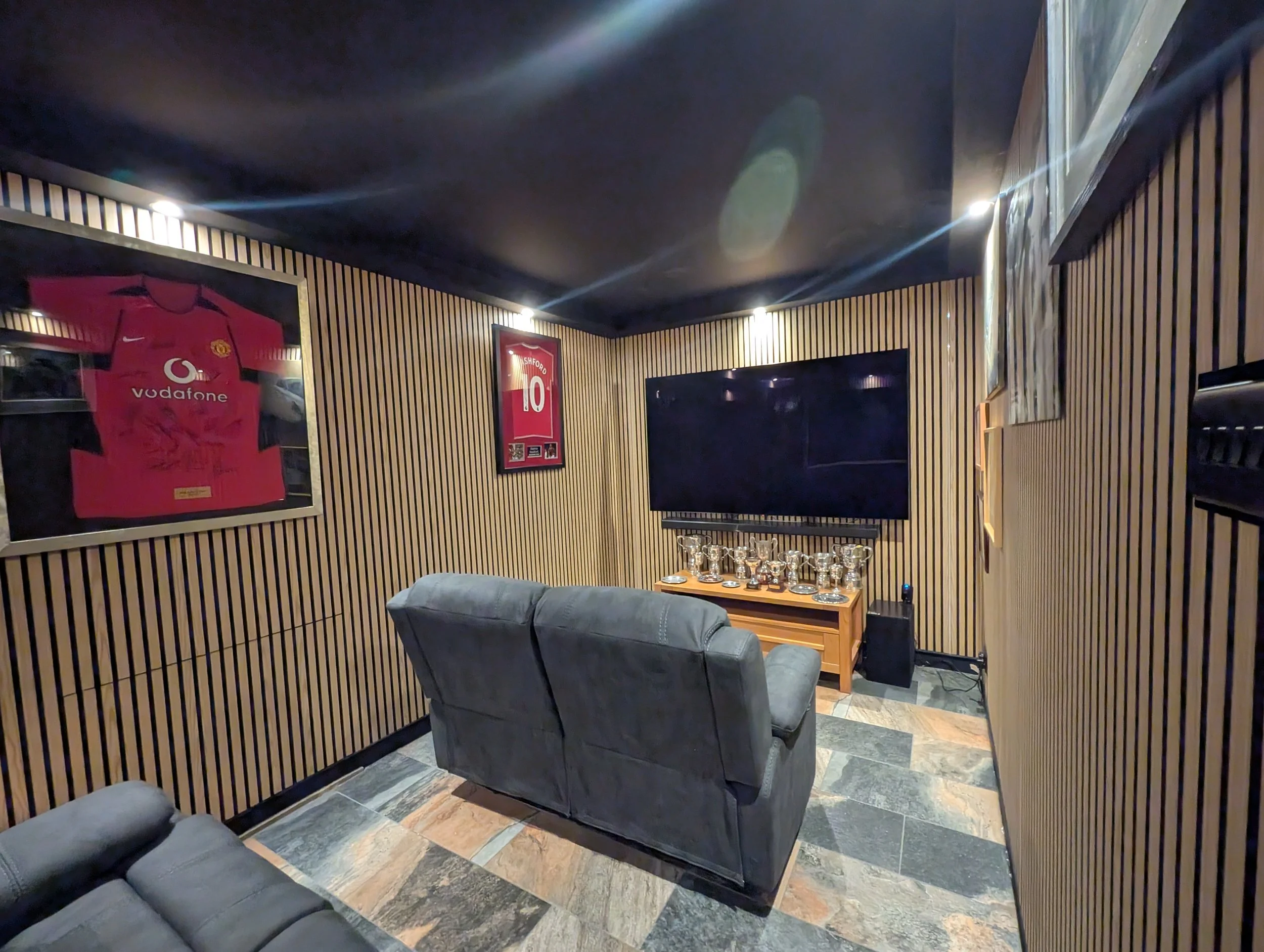 Cinema room installation with LED slat lights, uplights and perimeter downlights in Oxford