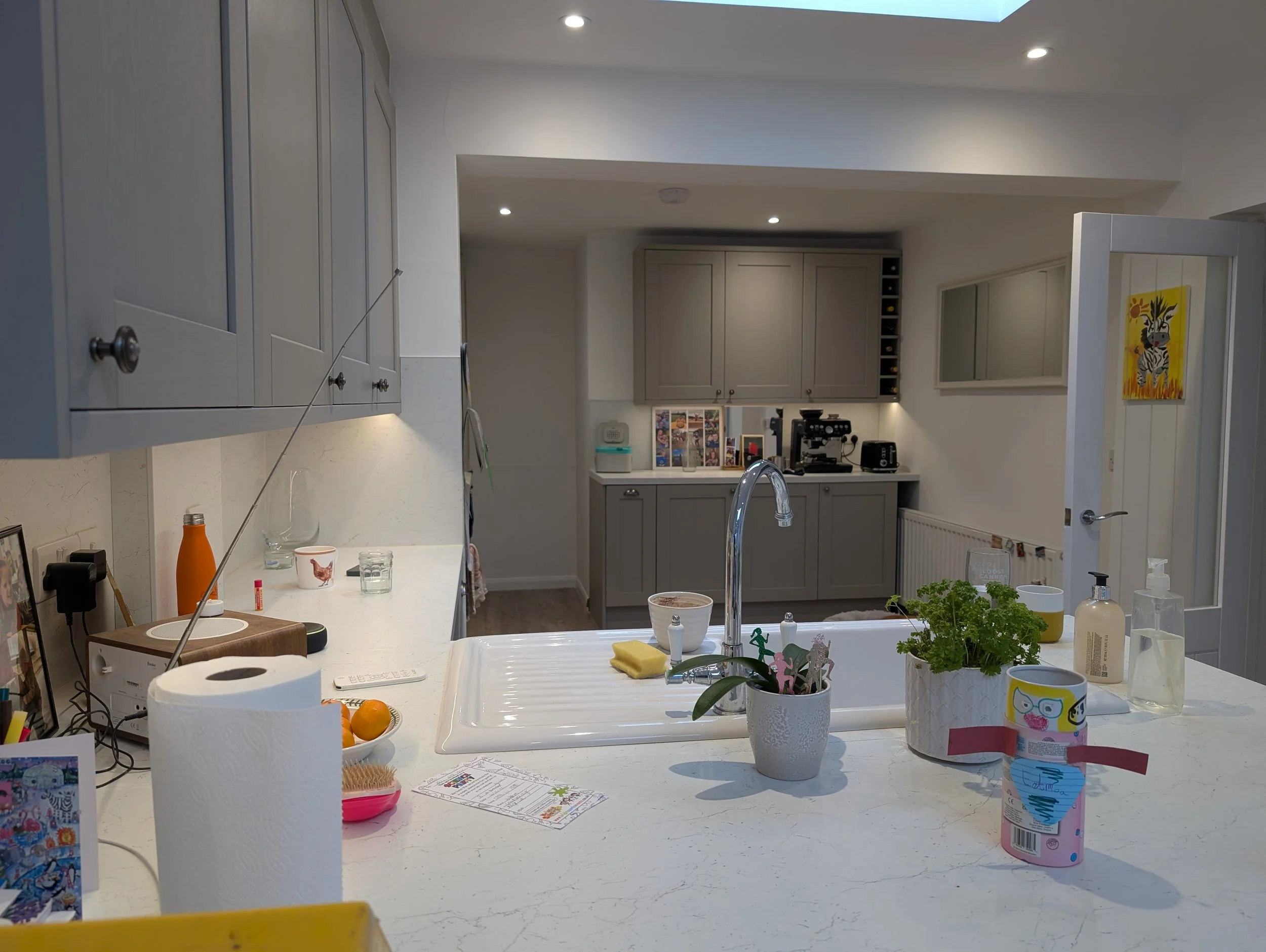 Extension and existing kitchen rewired with Collingwood downlights, new power and LED strip lights undercabinet, integrated with smart Quinetic wireless switching and dimming.