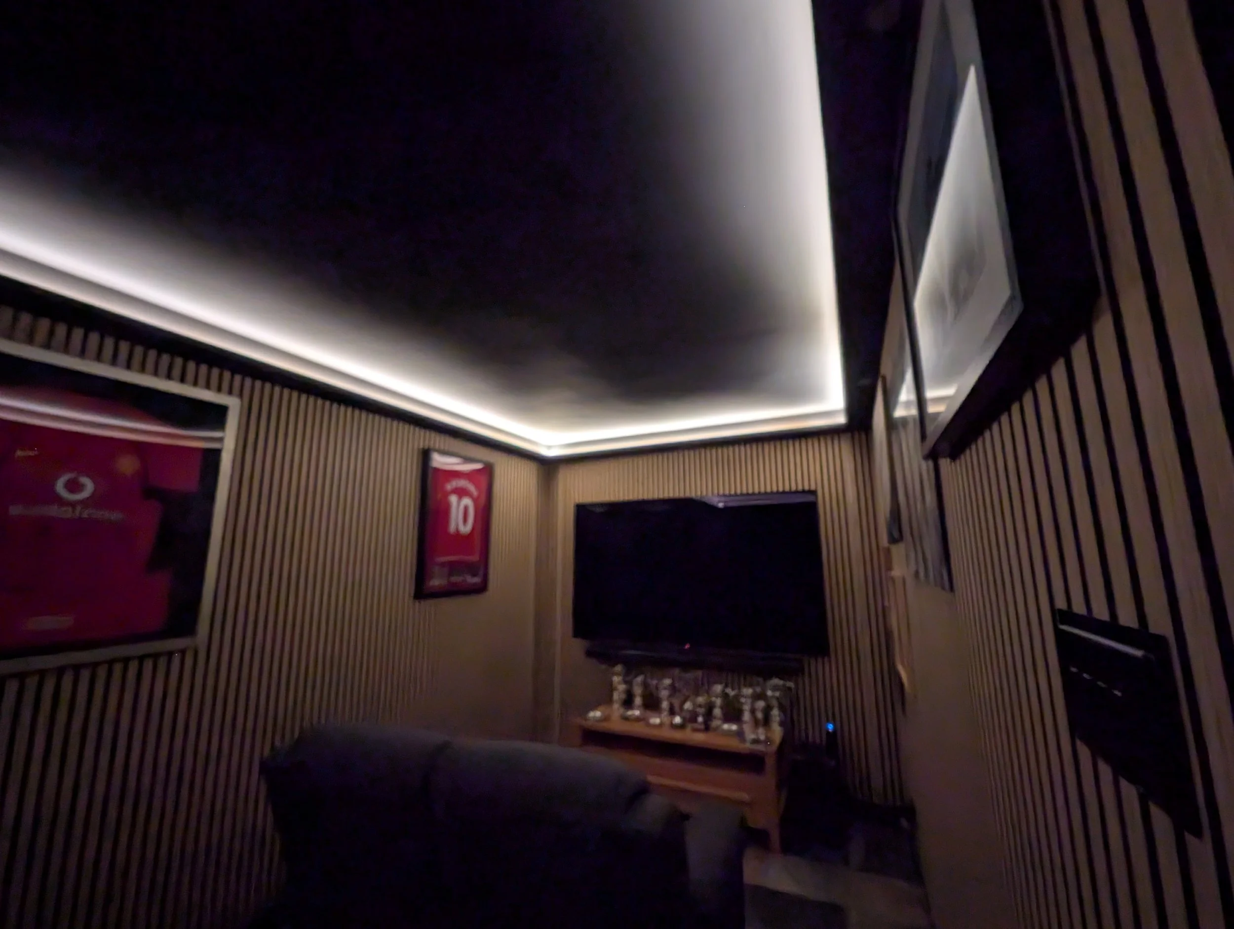 Cinema room installation with LED slat lights, uplights and perimeter downlights in Oxford