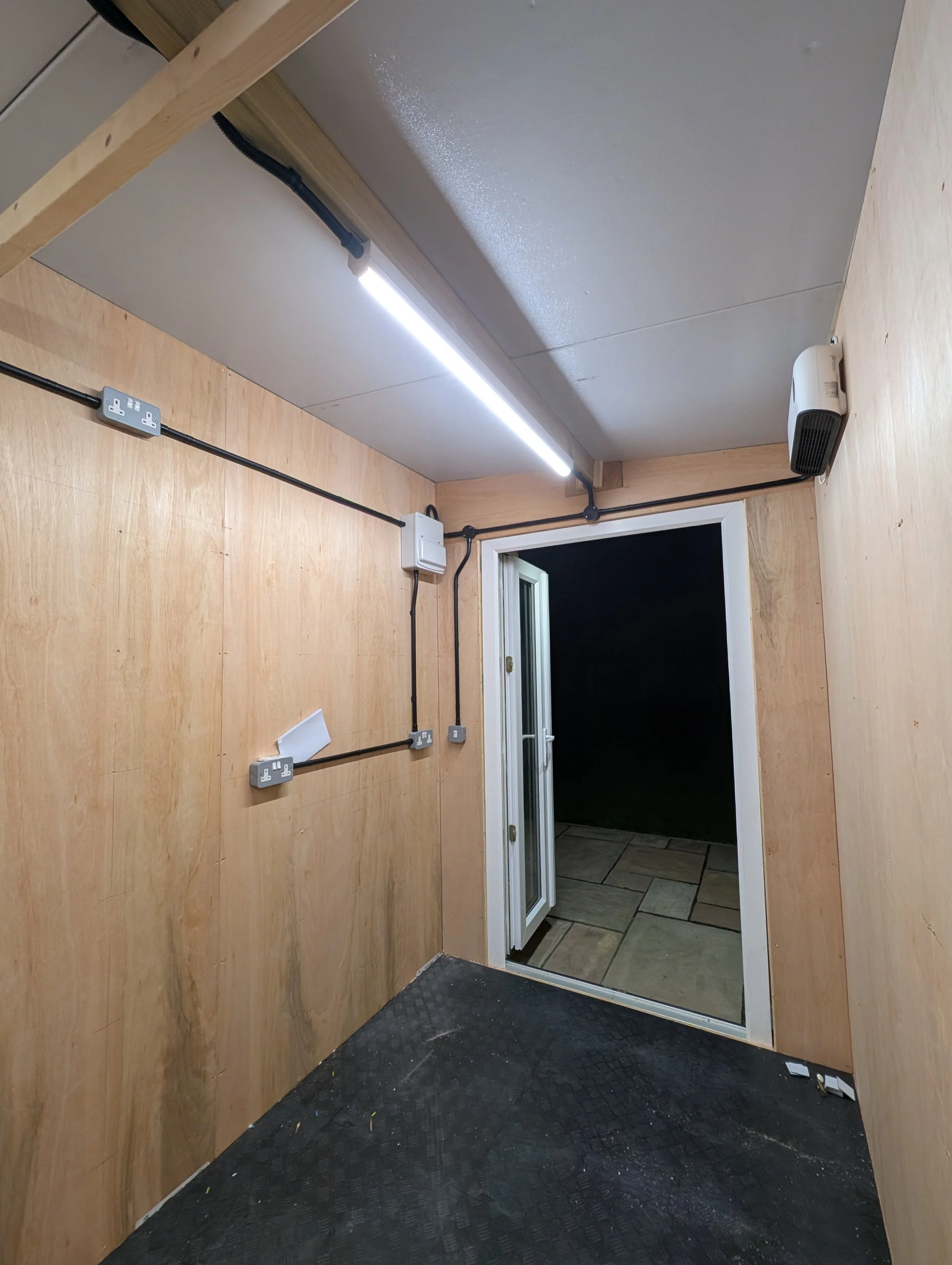 Outbuilding workshop install with PVC Plastic conduit and metal clad accessories near Swindon