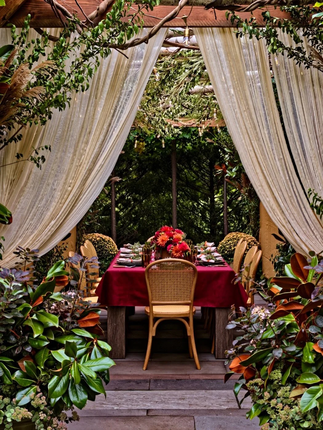For Sukkot, the sukkah becomes a temporary home for sharing meals, welcoming family and guests and celebrating beneath a roof open to nature.

For this sukkah, we brought the garden inside - branches overhead, magnolia and seasonal foliage in planter