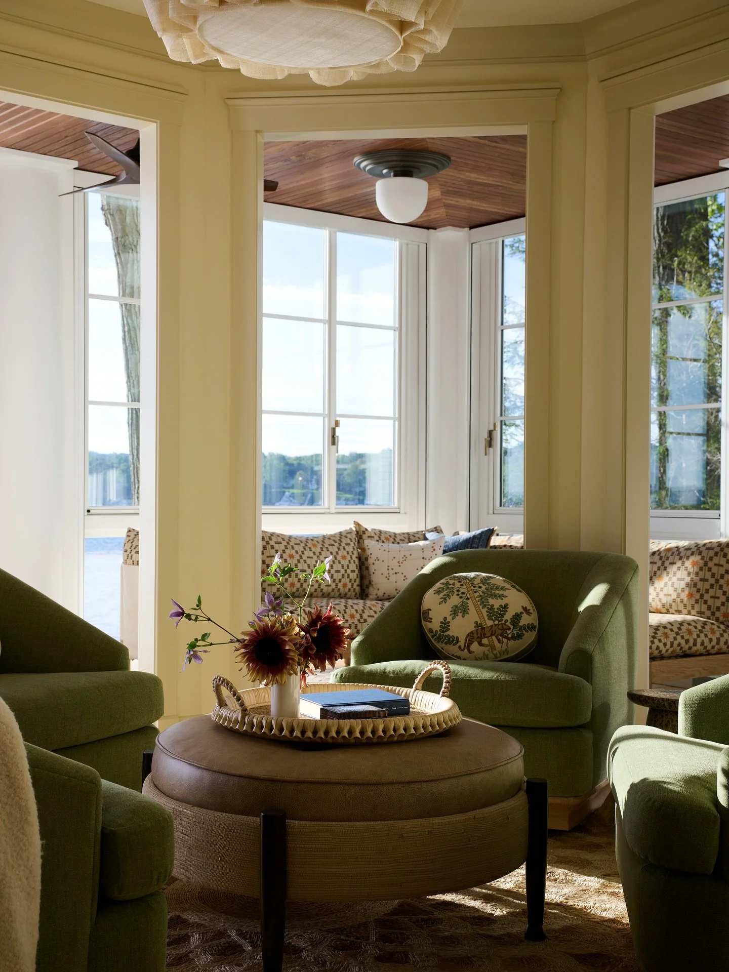 Layered spaces / This Lake Geneva home has a long history with many renovations over its 100+ years. Here, in the lounge area a relic of an original bay window can still be seen between the cozy lounge and sun porches beyond. These layered spaces def