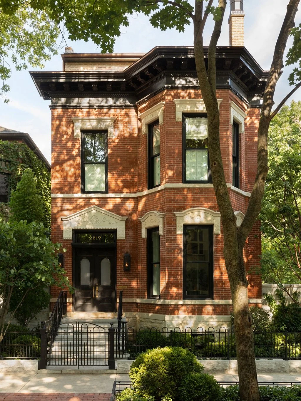Classic / This Classic Lincoln Park home was restored to its original glory. Found inside before this restoration the original front doors were reproduced exactly. A delicate metal and awning was made for additional function without distracting from 