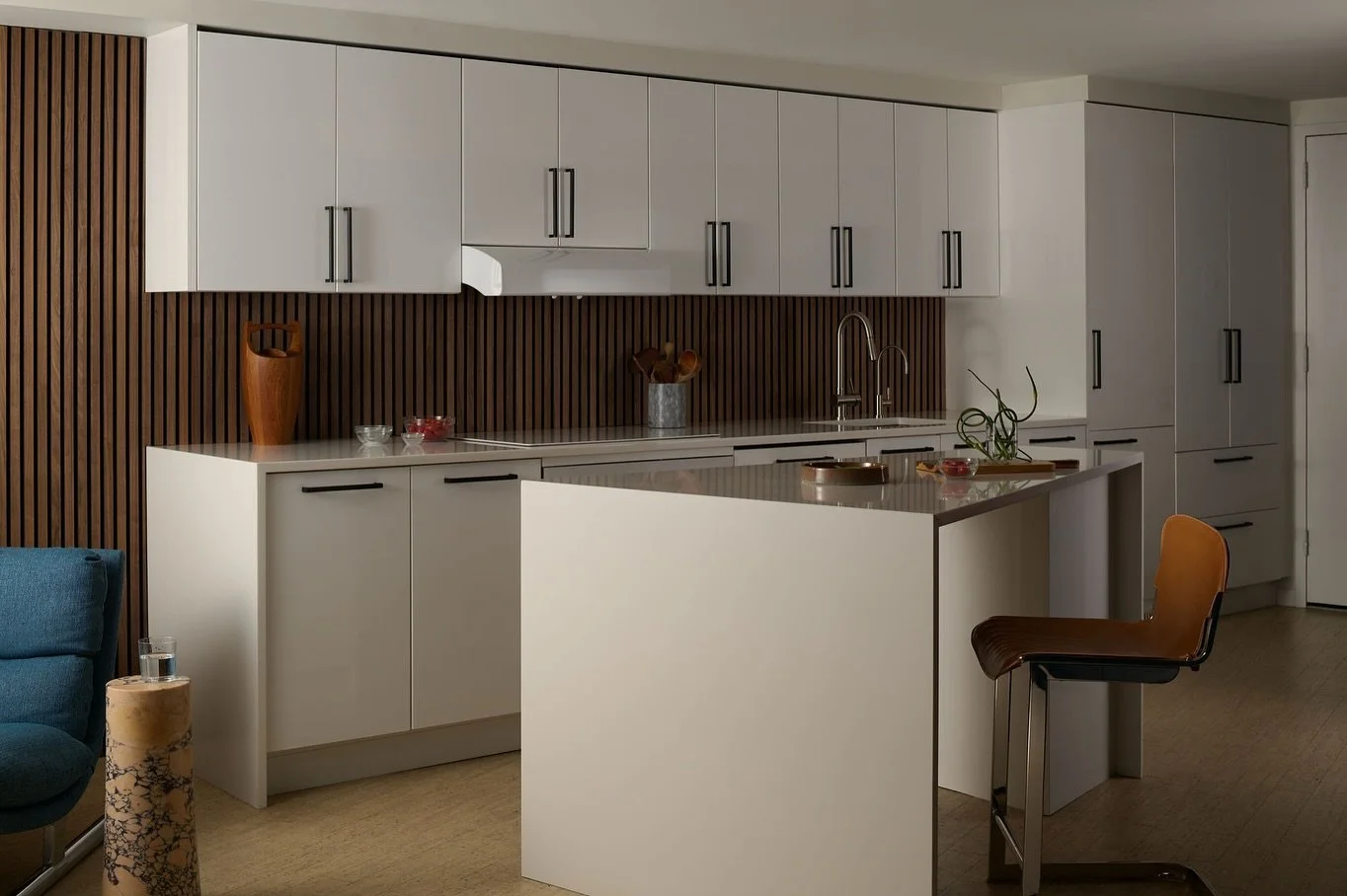 After + Before / This Marina City home had great bones but felt too cold for our client. We talked a lot about being back a 60s/70s vibe while also improving the acoustics. Enter this wall of walnut acoustic paneling. It added instant visual warmth b