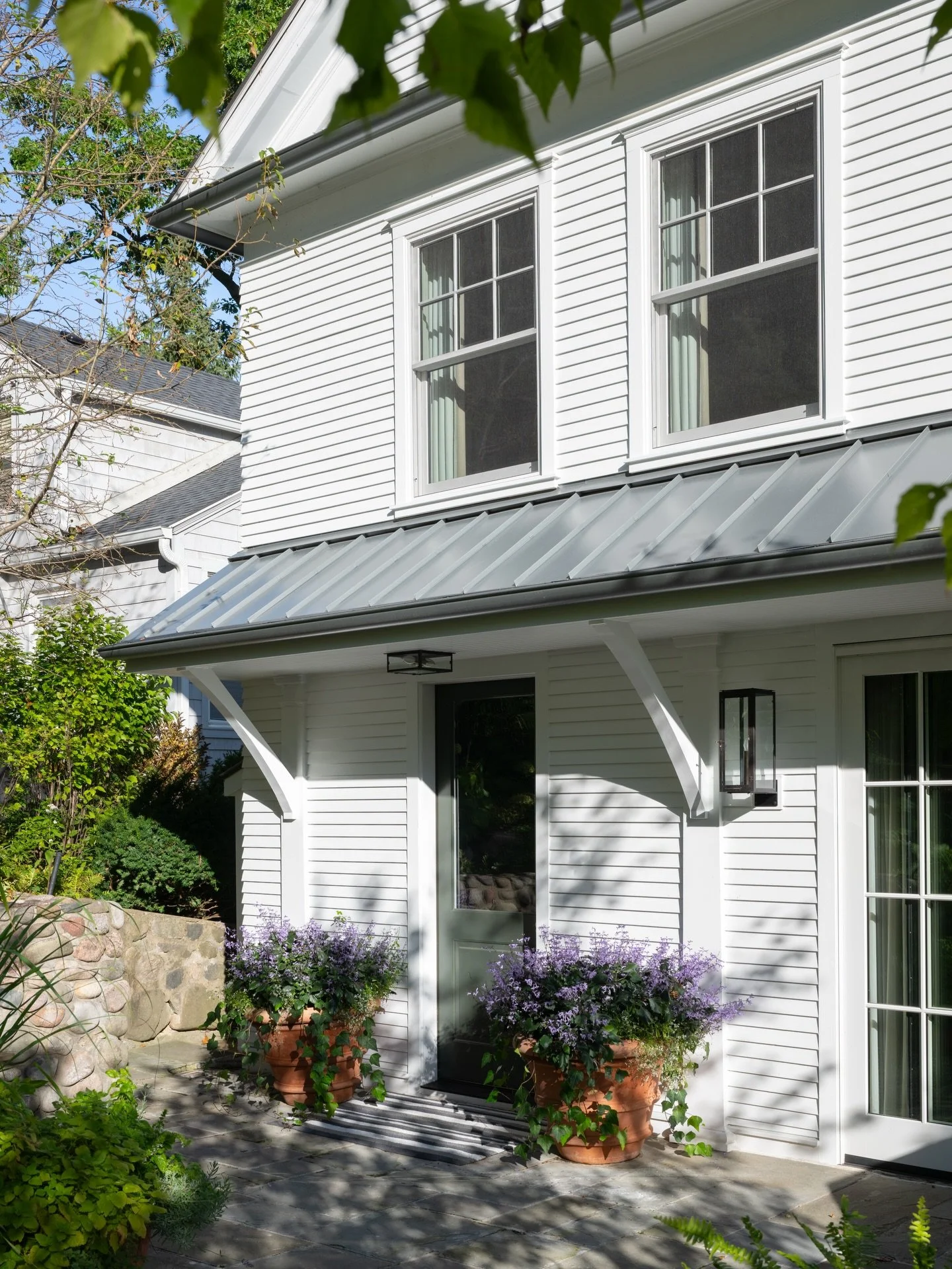 Garden Entry / This Lake Geneva Home is entered very casually from a lush hillside garden. This sets the tone for the home&mdash;welcoming, warm, casual, and intimate. #designenmasse 📸 @jeffreyjohnsonpictures Landscape Architect @hoerrschaudt Interi
