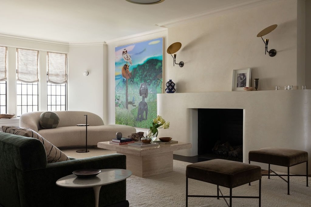 Sculptural /  An over scale curved plaster clad fireplace set the tone for this 1920s co-op living room. Sculptural furnishings create an intimate gathering space with personality and a collected feel. #designenmasse 📸 @aimeemazzenga Stylist: @cate.
