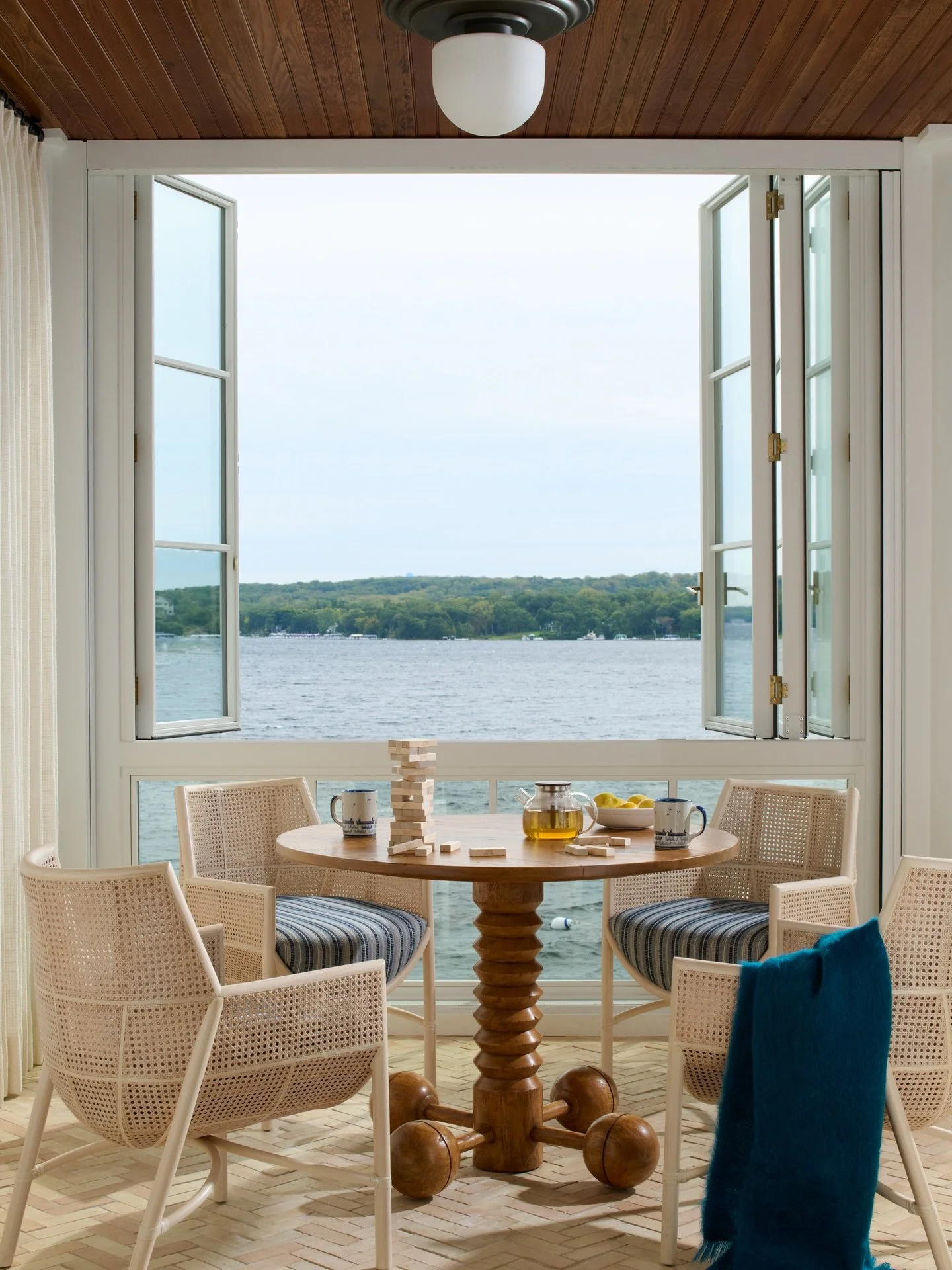 4 Seasons / Designed to embrace the outdoors though folding windows in warm months and to be a sunny spot in long winters this Four Seasons Room is a multipurpose space built for relaxation. #designenmasse 
📸 @jeffreyjohnsonpictures 
Stylist: @cate.