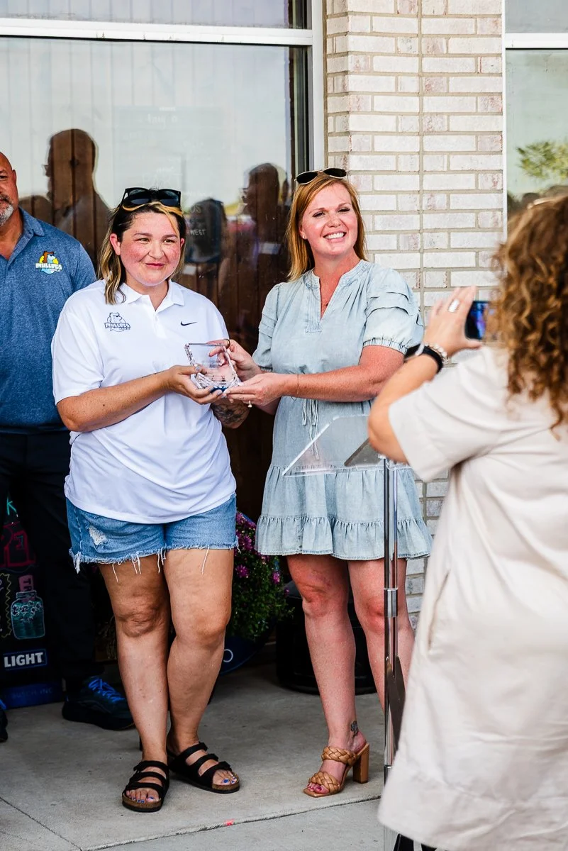 Waukee Chamber of Commerce presenting Mullets Waukee an Award