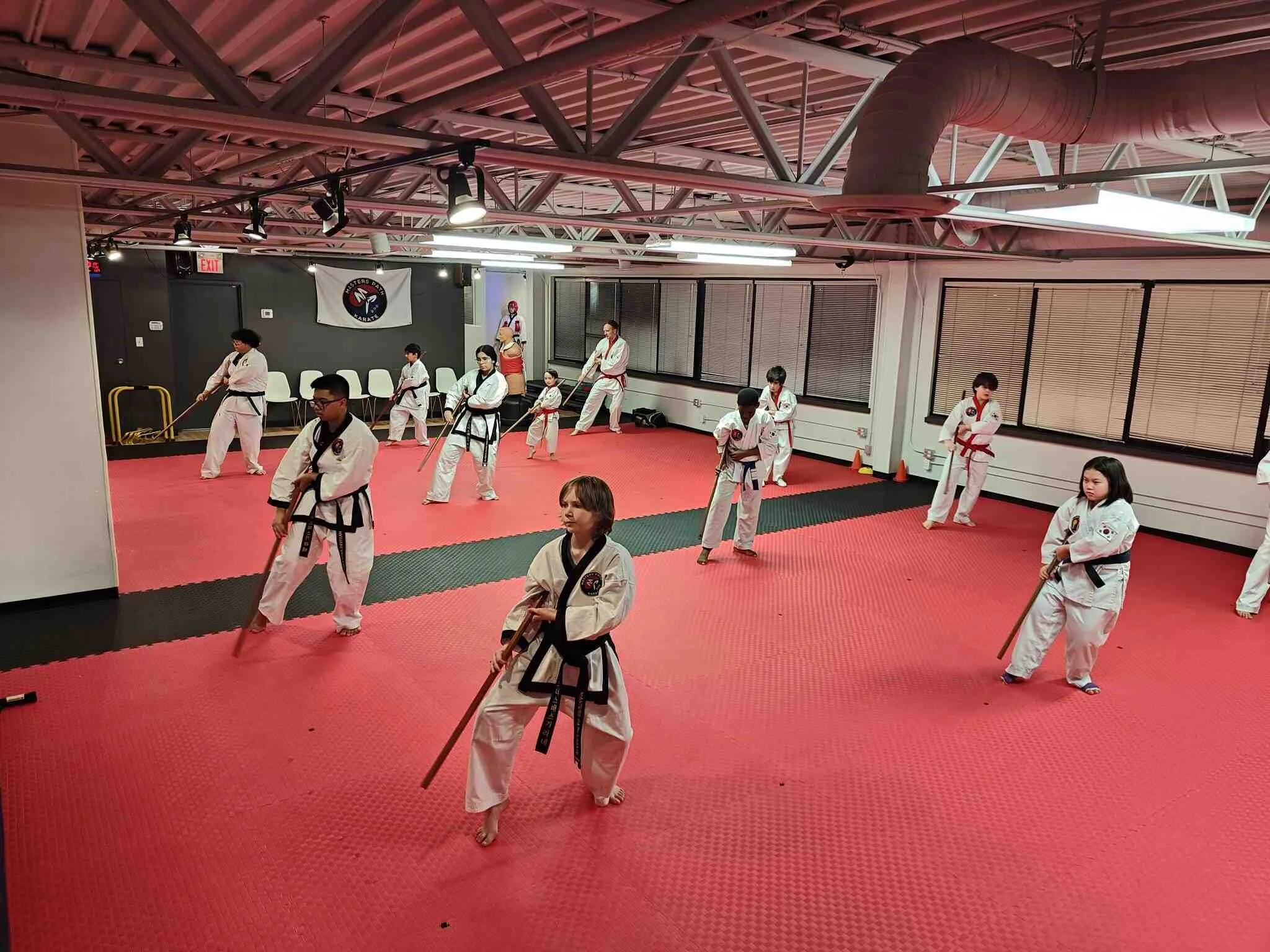 Masters Path Karate Traditional Tang Soo Do students learning bow staff