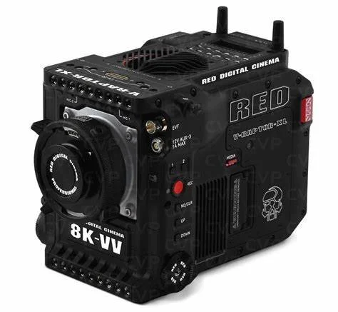 Professional 8K digital cinema camera with multiple buttons, dials, and antennas, labeled RED DIGITAL CINEMA, RED, and 8K-WV.