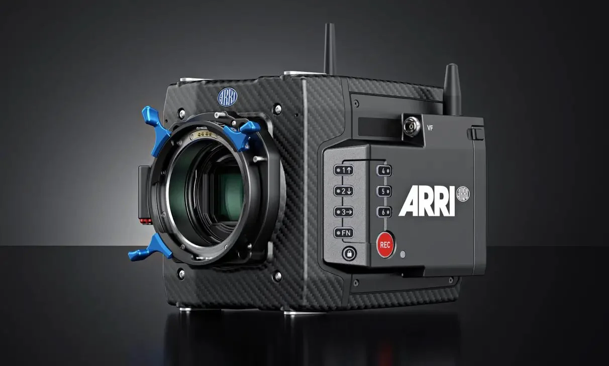 A compact ARRI camera with a carbon fiber body and various control buttons, featuring a large lens mount and a red record button.