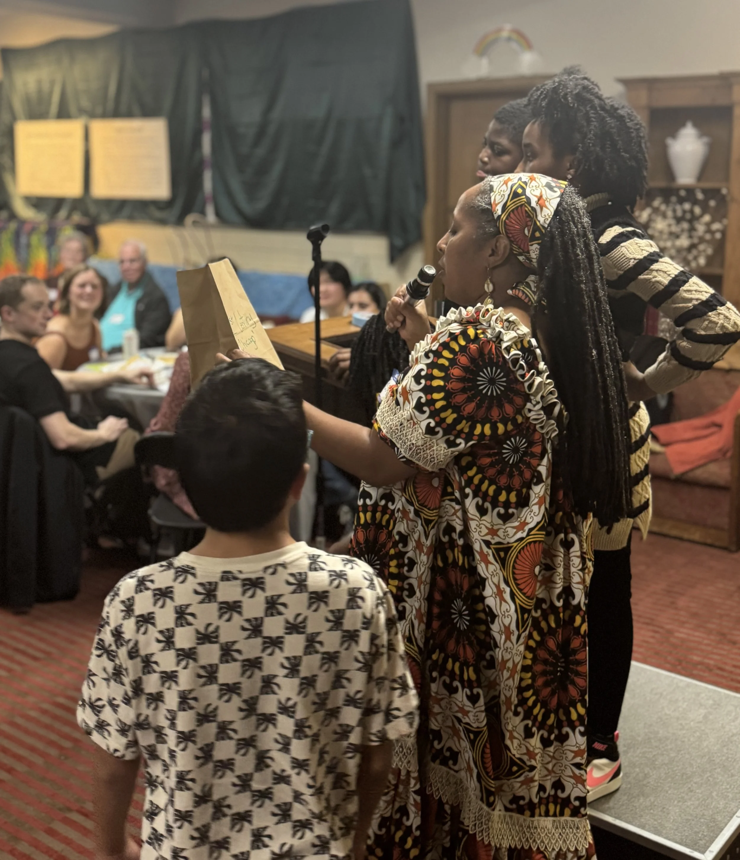 Fasika, aided by some of the young people in attendance, read out the numerous raffle winners for the night. We were all winners by the end!