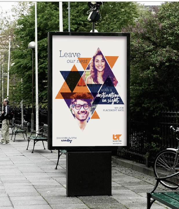 Outdoor advertising poster with two smiling young adults, a woman and a man, surrounded by orange and dark blue geometric shapes. The text says "Leave our nest with a destination in sight" and promotes university placement with a 95% job placement rate, featuring the University of Toronto Mississauga logo.