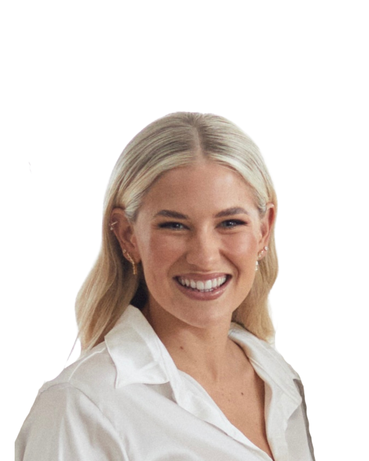 A smiling blonde woman wearing a white collared shirt and small earrings, against a plain white background.