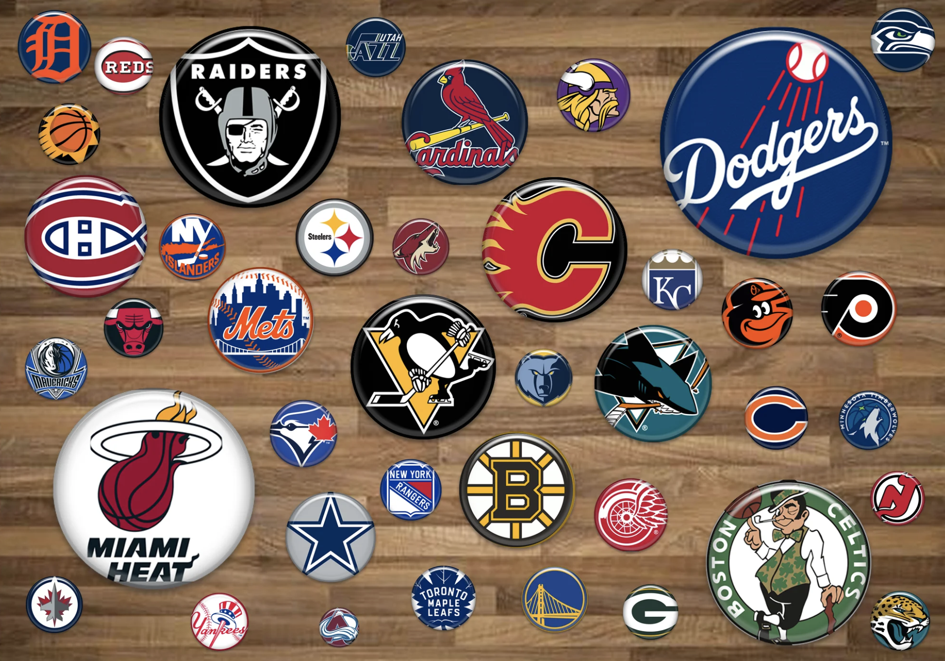 Collection of sports team logos on a wooden surface, including baseball, basketball, hockey, and football teams from various cities.