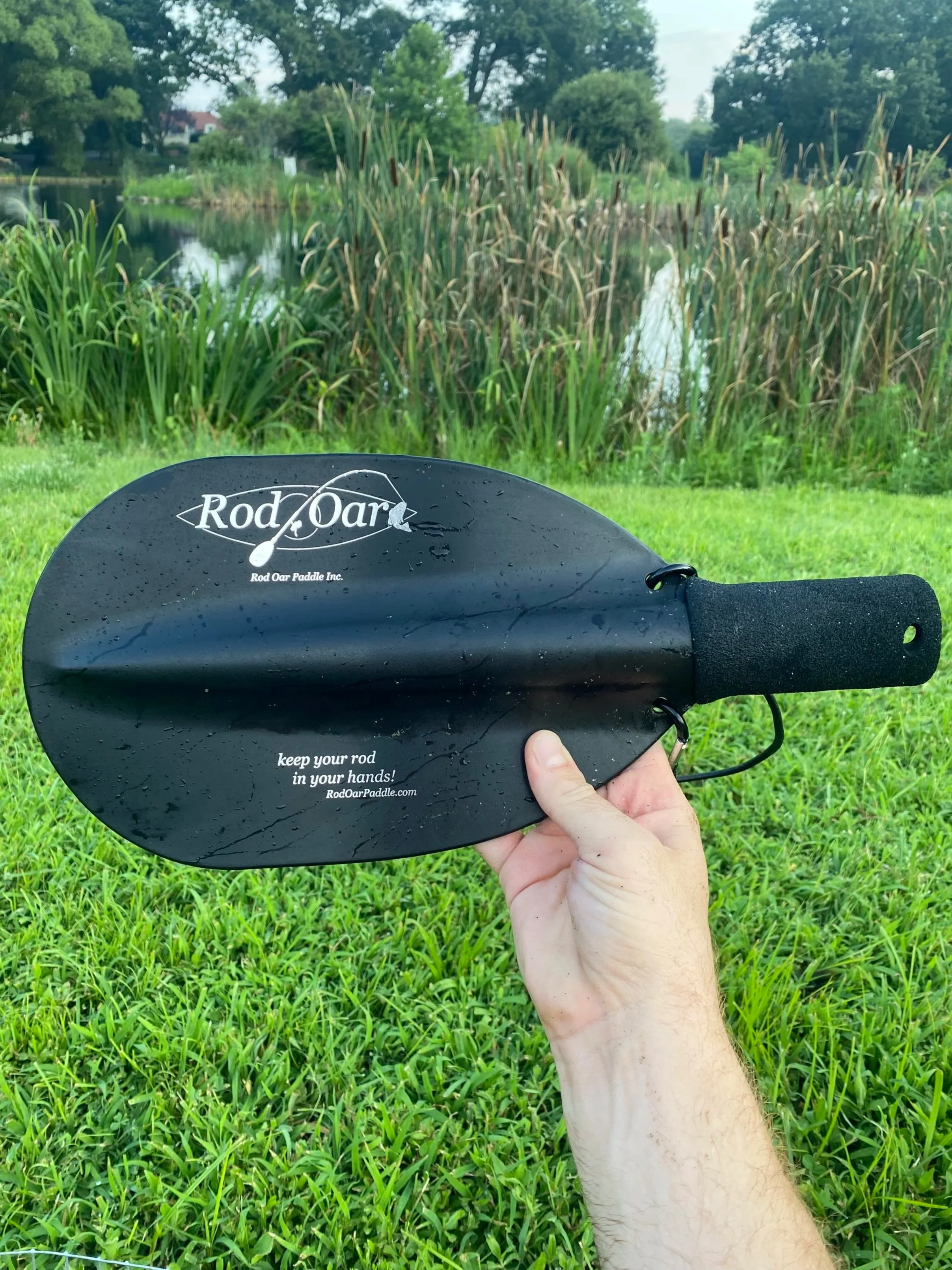 RodPaddle kayak fishing paddle with rod holder socket