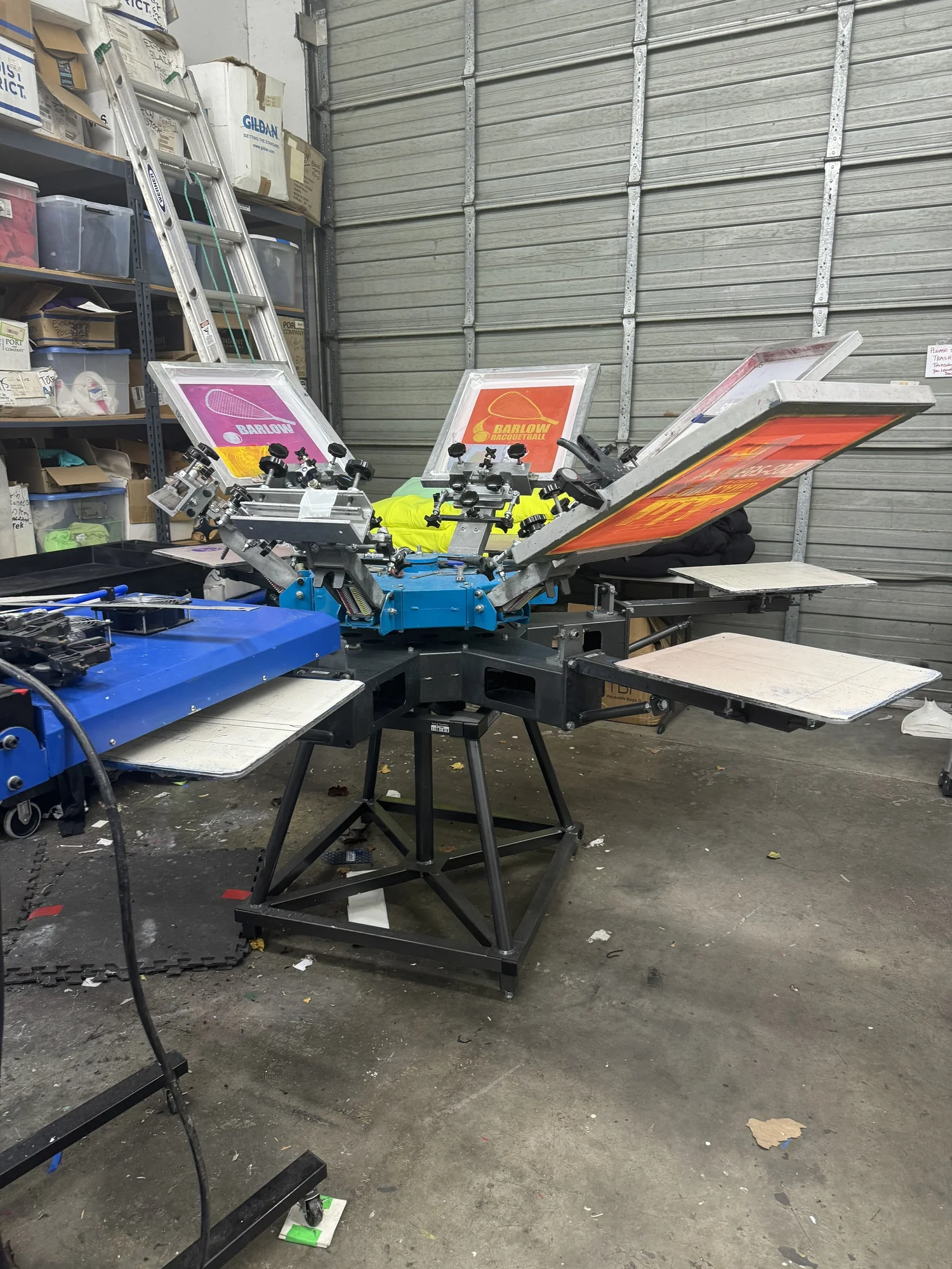 Colorful screen printing press in the Tapestry Inkworks shop