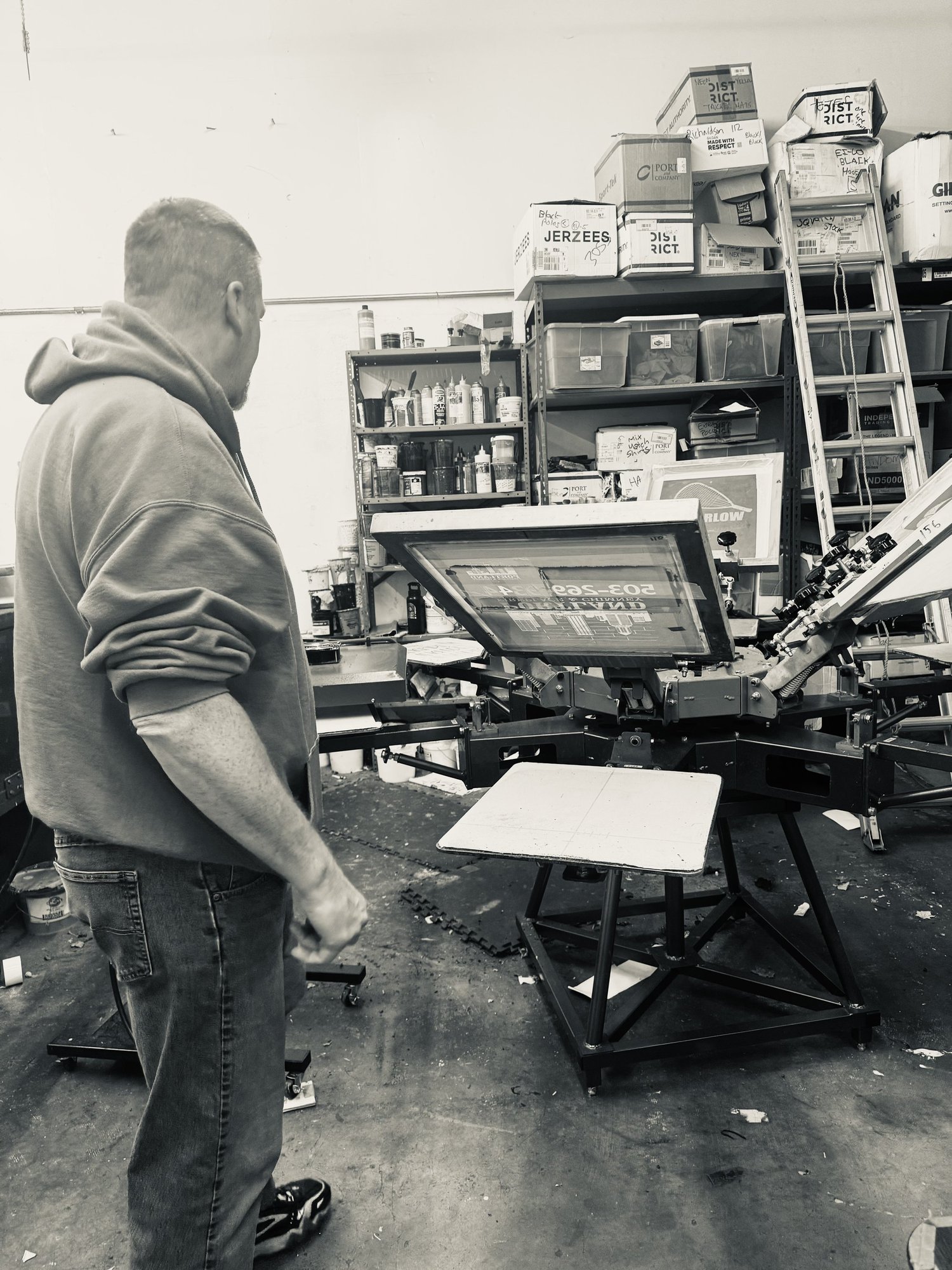 Screen printing press in the Tapestry Inkworks shop