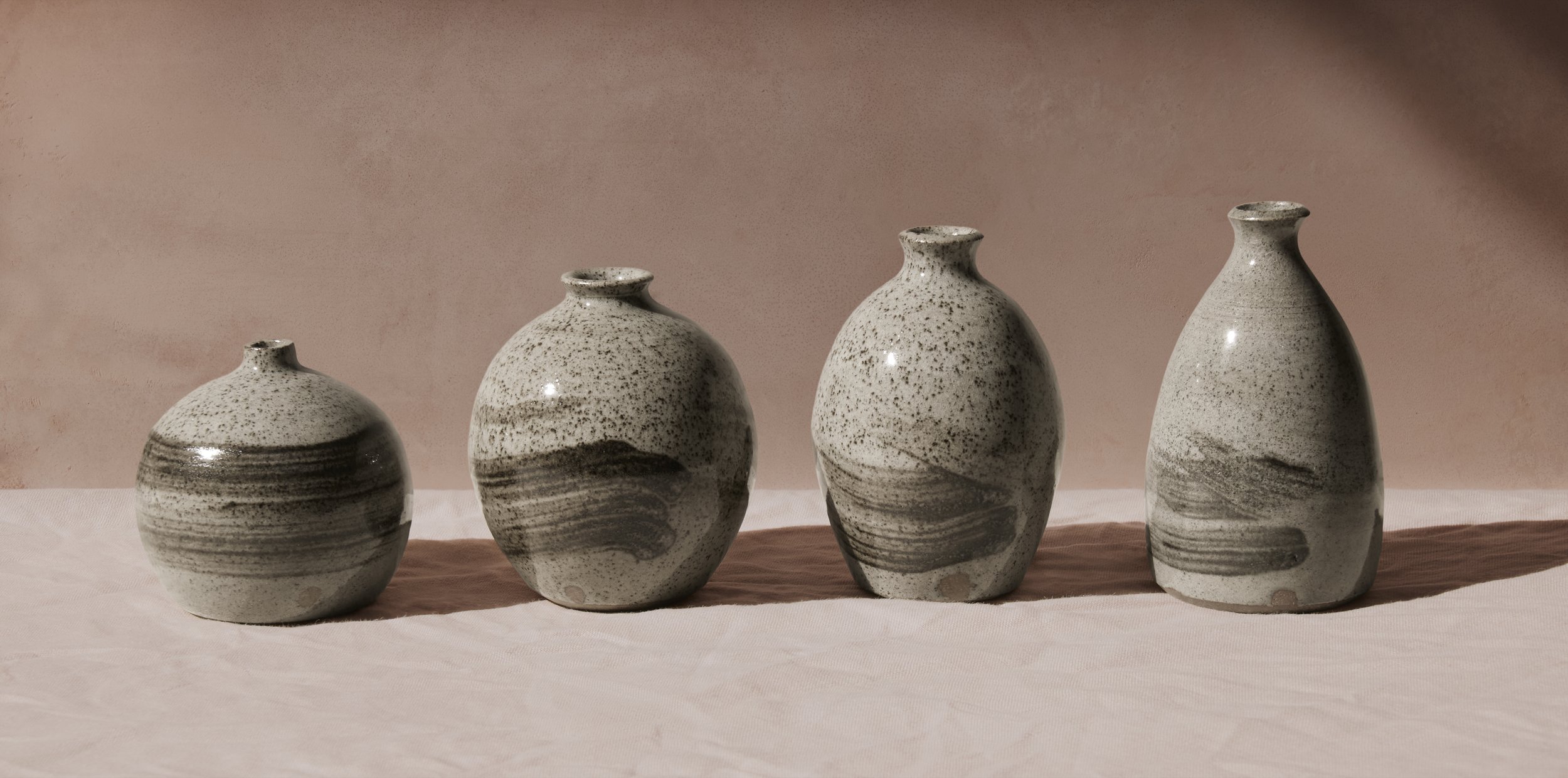 Woodfired bud vases decorated with Herefordshire wild clay slip. Made by Marnie Waghorn in Sheffield and woodfired in the Peak District.