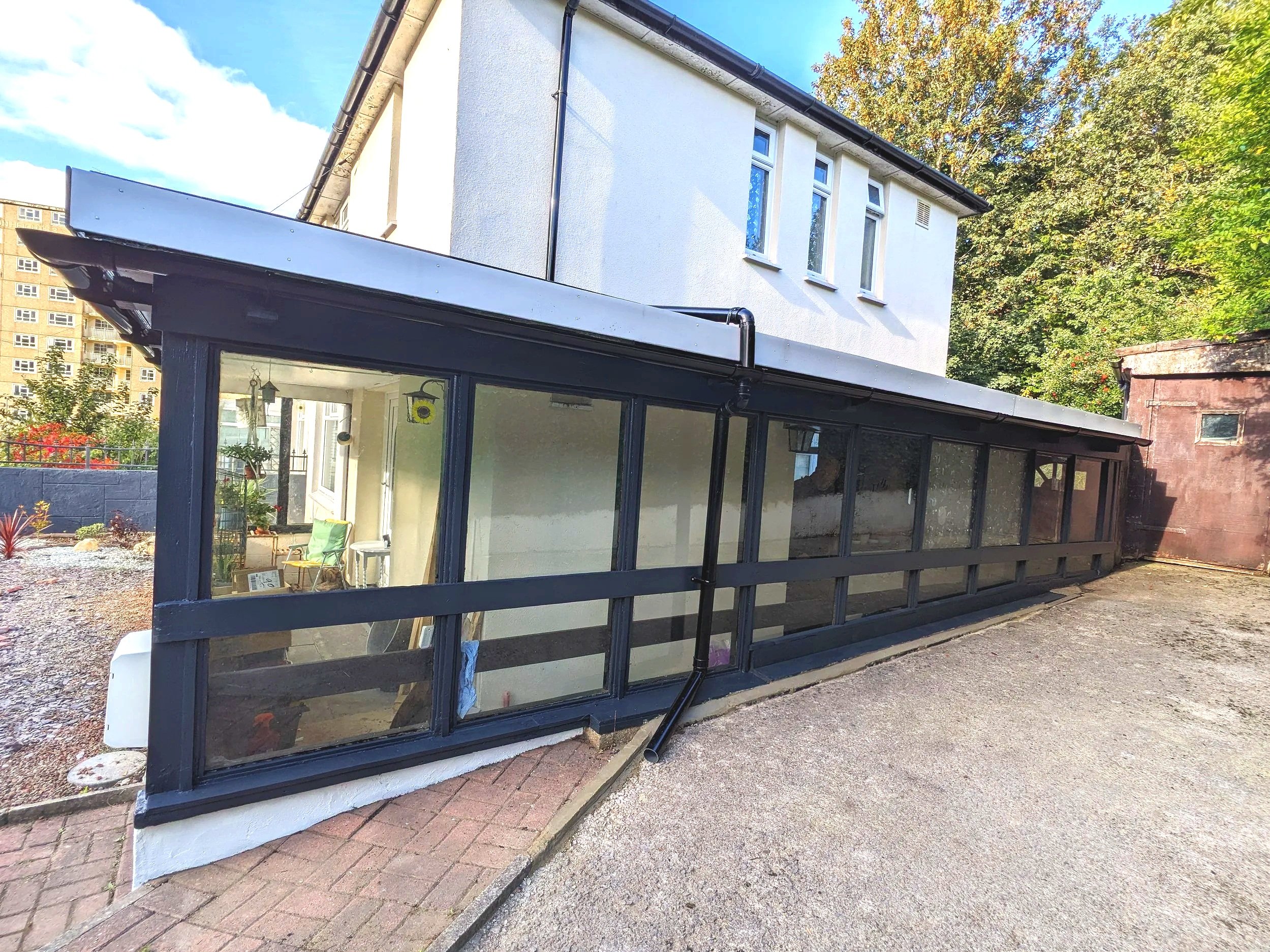 after - with installation of better downpipe direction and new felt roofing.