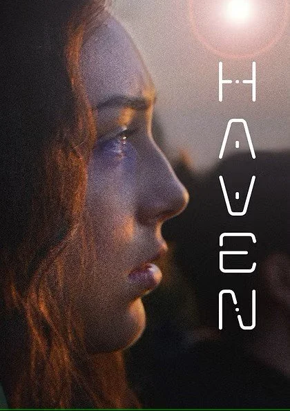 Profile of a woman with red hair, looking to the right, with sunlight shining behind her and the word 'HAVE' vertically aligned beside her face.