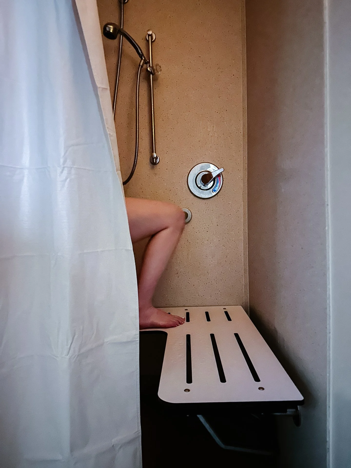 I quietly entered the birth room as she walked into the shower. I set my bag down, assessed the space, and listened to a few contractions while she found her rhythm in the water. With her partner standing beside her, I snuck away to quickly hang up t