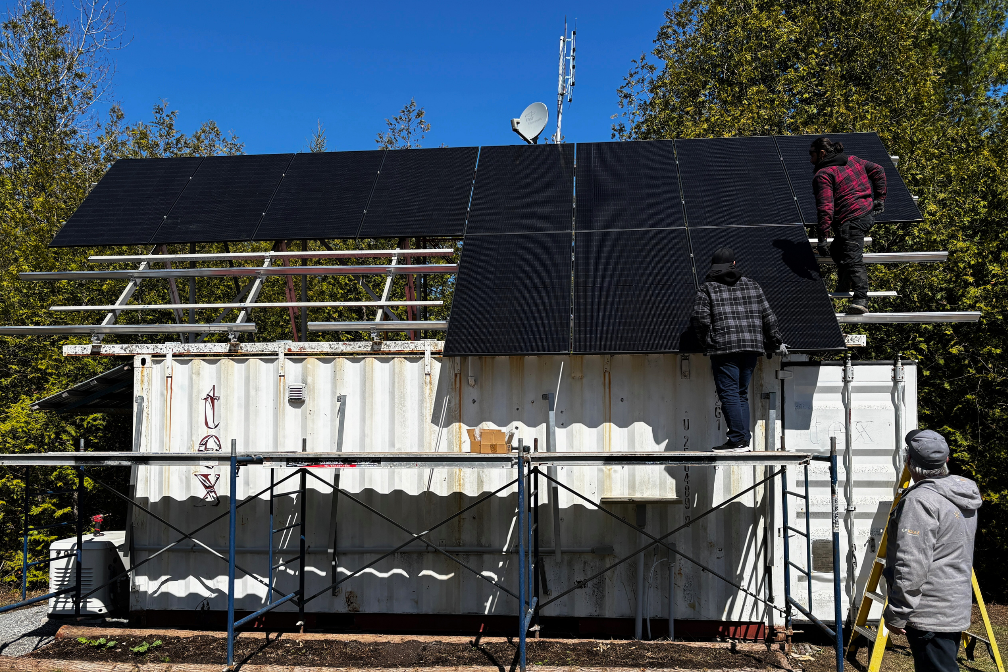 Our team installing the 500 Watt Longi solar panels on the main roof-mounted array. The 500 Watts Longi panels are replacing the older 235 Watt solar panels to more than double the solar capacity. 